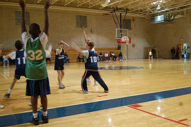 Chace Basketball 2-10 0004.JPG - Chace (#10) on defense in the first half.  Chace's team consists of players from his school class.  They play against teams from other schools in the area.  Boys and girls play together at this level.